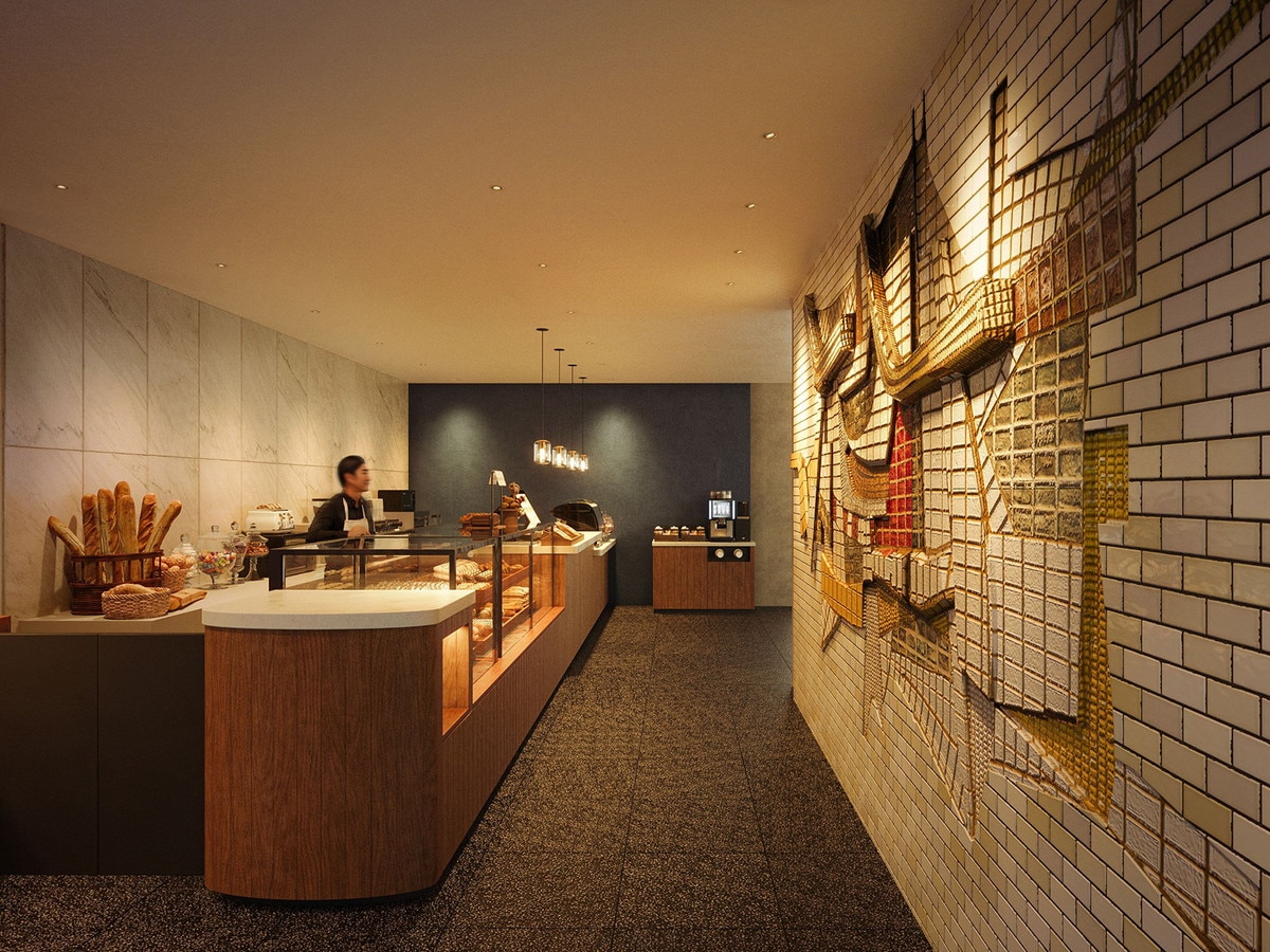 OMOベーカリーの壁面には泰山タイルレリーフ「海・波・船」を原位置保存