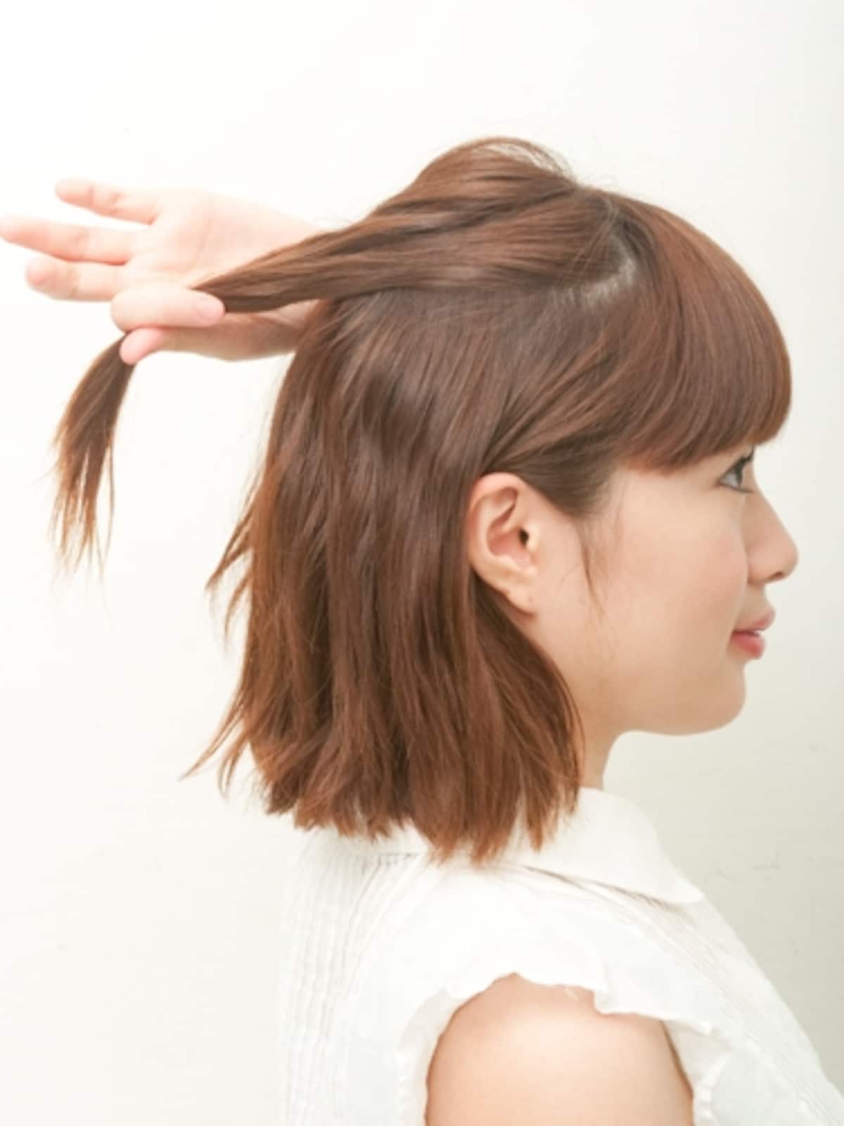 後ろに向かってひっぱるとねじりやすい