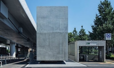 Floating Concrete Block Hides Stylish Restroom