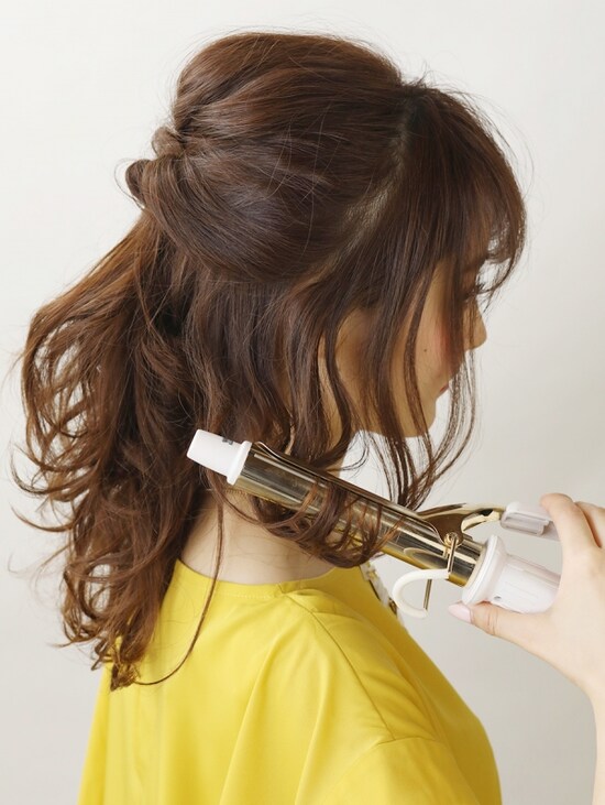 髪を巻きなおす