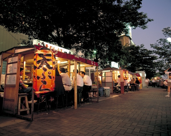 4. Bask in street festivities and delicacies at the local Nakasu Street Stalls!