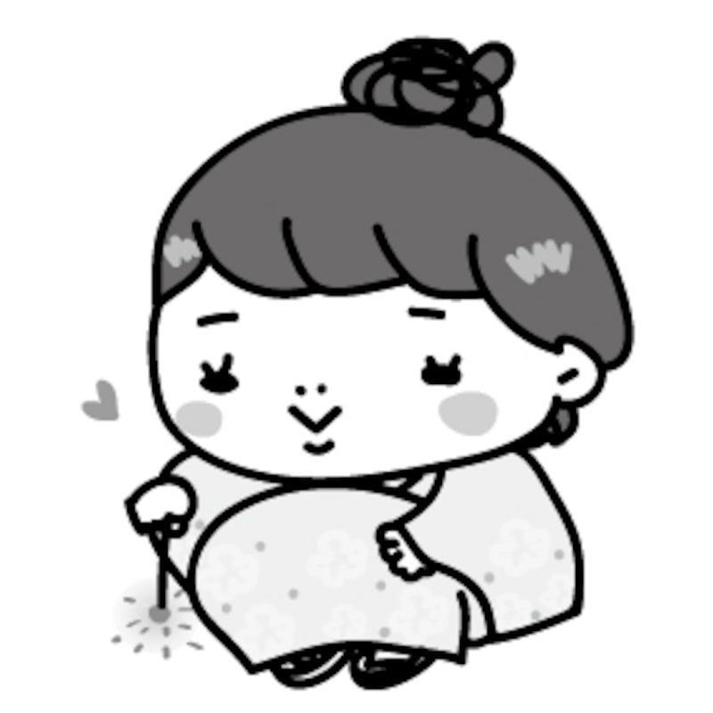 【モノクロ】浴衣を着て、線香花火を楽しむ女の子です。