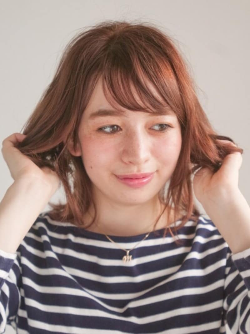 毛先～中間までを中心にもみこむ