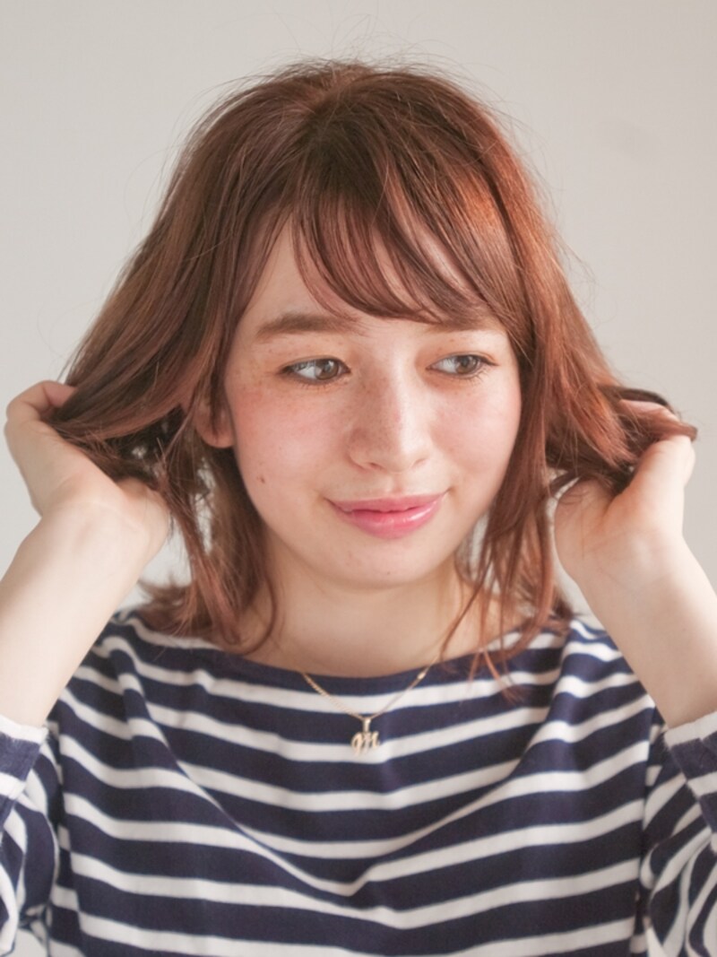 毛先～中間までを中心にもみこむ