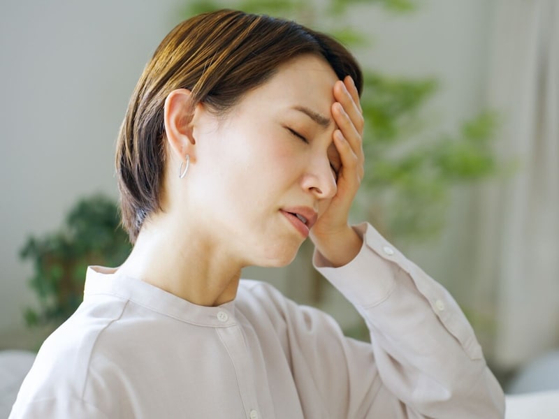 不調に悩む女性