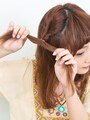 結び目を根元まで締める