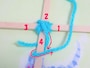 4の下を通した毛糸を1の上に持って行きます。