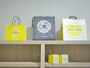 お店のテーマカラーである黄色基調の紙袋と、グレーがシックな保冷バッグ