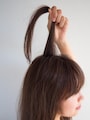 表面の髪を真上に引き出す