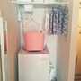 ゴチャゴチャしがちな洗濯用品はおしゃれなカーテンでスッキリ目隠し