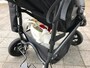 ベビーカーの荷物入れに入ったトートバッグ