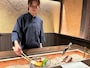 スタッフによる炭火焼
